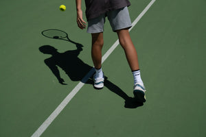 Why do tennis players wear long socks?
