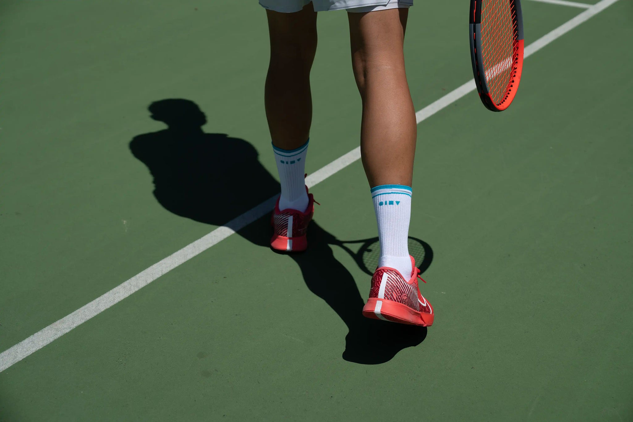 Should I wear thick socks when playing tennis?