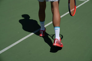Should I wear thick socks when playing tennis?