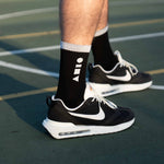 Clay Active black men's athletic sock on basketball court.