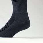 Clay Active men's grey athletic crew sock close up of cushioning in studio.