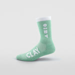 Clay Active green men's athletic sock studio shot.